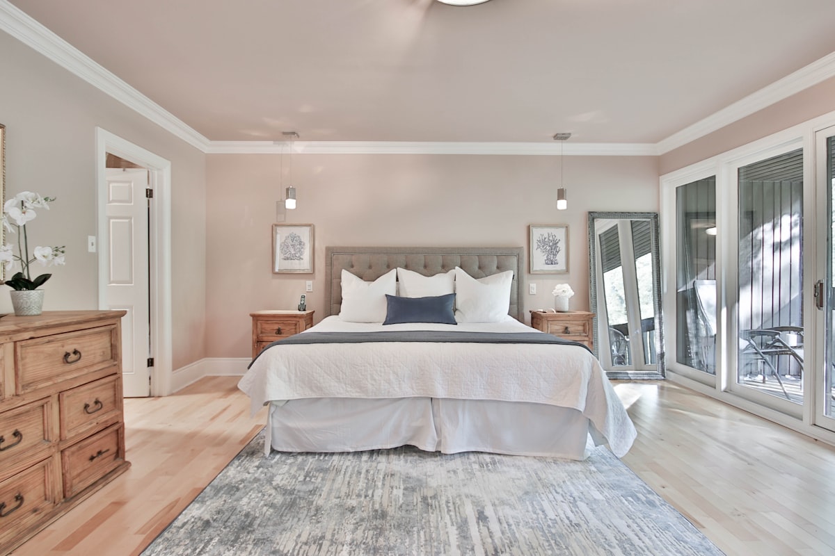 Primary bedroom with crown moulding